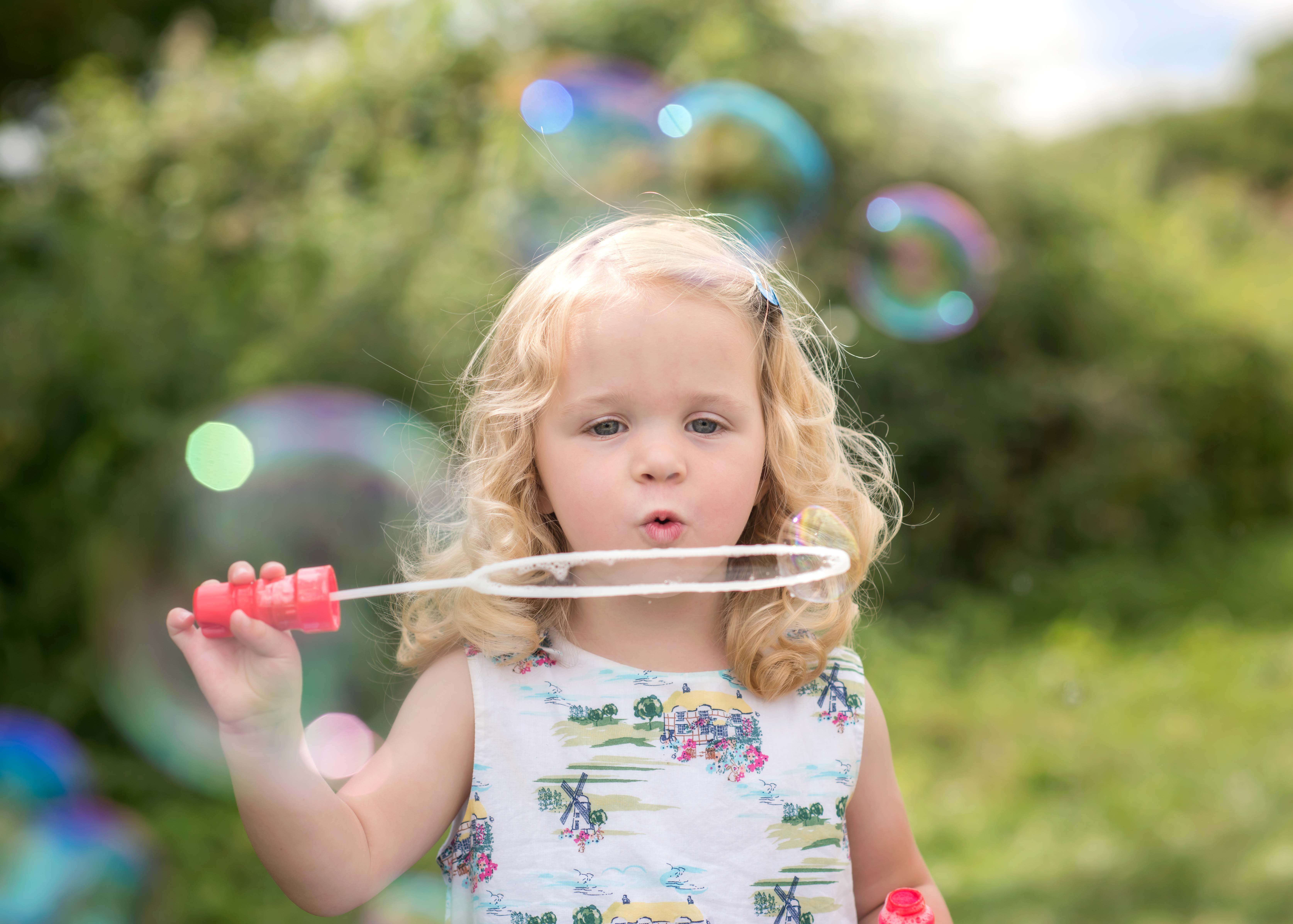 Girl blowing bubbles