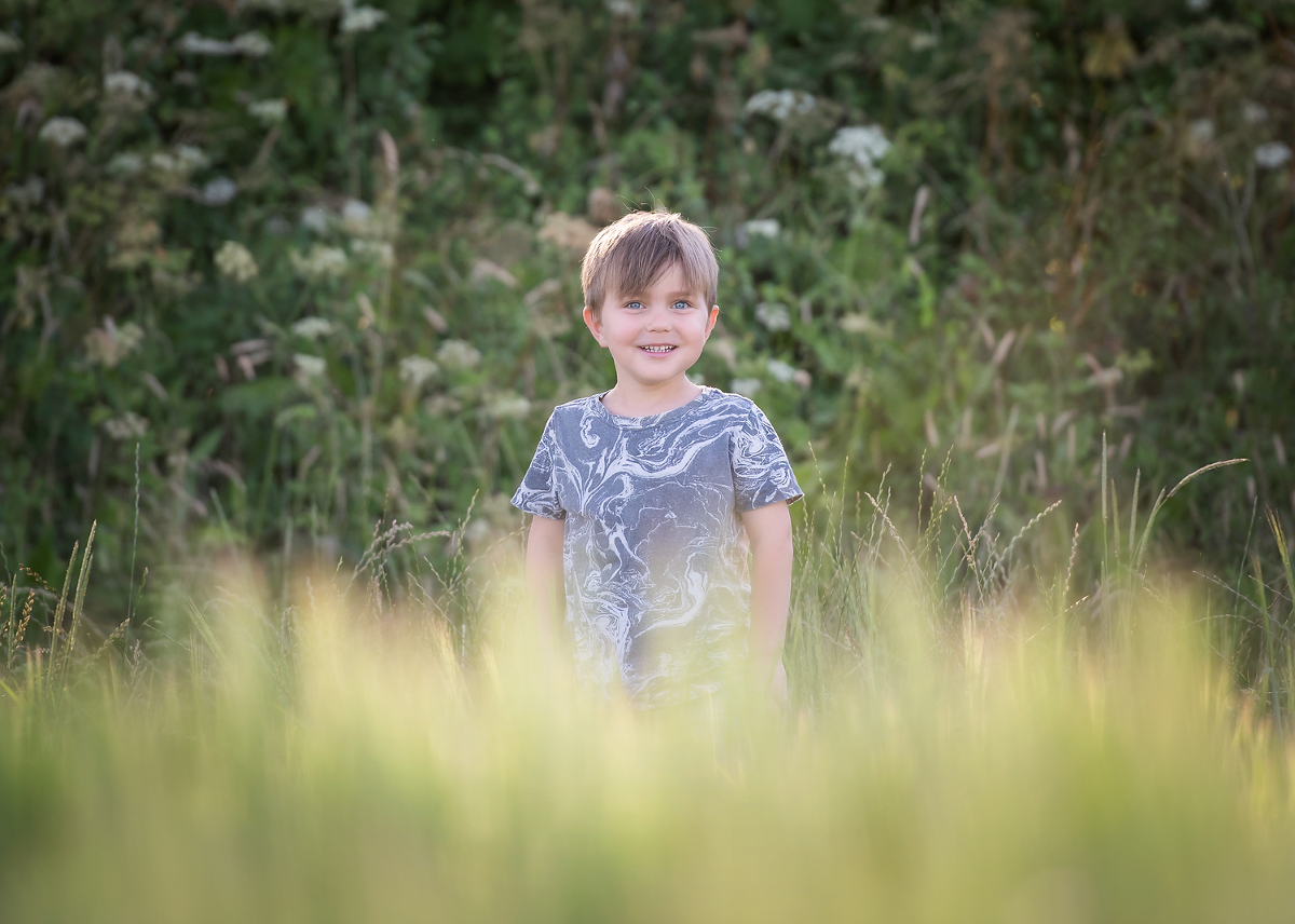 Boy enjoying a photo shoot in the meadows